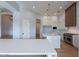 Sleek kitchen with white countertops, modern appliances, and a spacious island at 11328 E Dreyfus Ave, Scottsdale, AZ 85259