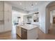 Spacious open kitchen and living area with island and modern finishes at 11328 E Dreyfus Ave, Scottsdale, AZ 85259