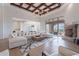 Open concept living area with fireplace, large windows, and access to the kitchen at 11328 E Dreyfus Ave, Scottsdale, AZ 85259
