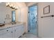 Luxurious ensuite bathroom with walk-in shower, marble countertops, and double vanity at 11328 E Dreyfus Ave, Scottsdale, AZ 85259