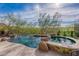 Backyard oasis with a pool, spa, and desert landscaping at 11328 E Dreyfus Ave, Scottsdale, AZ 85259