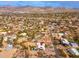 Aerial view of a home with a pool and solar panels, nestled in a desert community at 12550 E Silver Spur St, Scottsdale, AZ 85259