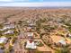 Aerial view of a home with a pool and solar panels in a desert setting at 12550 E Silver Spur St, Scottsdale, AZ 85259