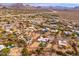 Aerial view showing a home with a pool, located in a desert residential area at 12550 E Silver Spur St, Scottsdale, AZ 85259