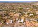 Aerial view of a house with a pool, solar panels and desert landscape at 12550 E Silver Spur St, Scottsdale, AZ 85259