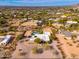 Aerial view of a home with a pool and desert landscape at 12550 E Silver Spur St, Scottsdale, AZ 85259
