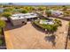 Aerial view of a home with a pool and desert landscape at 12550 E Silver Spur St, Scottsdale, AZ 85259