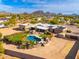 Aerial view of a home with a pool and desert landscape at 12550 E Silver Spur St, Scottsdale, AZ 85259