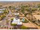 Aerial view of a single-story home with a pool and desert landscape at 12550 E Silver Spur St, Scottsdale, AZ 85259