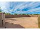 Large, unimproved backyard with block wall and storage shed at 12550 E Silver Spur St, Scottsdale, AZ 85259