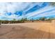 Spacious backyard with partial view of the house and landscaping at 12550 E Silver Spur St, Scottsdale, AZ 85259