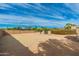Empty lot with block wall and partial view of the property at 12550 E Silver Spur St, Scottsdale, AZ 85259