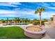 Relaxing backyard with a pool, fire pit, and built-in grill at 12550 E Silver Spur St, Scottsdale, AZ 85259