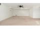 Spacious basement with neutral carpeting and ceiling fan at 12550 E Silver Spur St, Scottsdale, AZ 85259