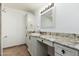 Bathroom with granite countertop, large mirror, and tiled shower at 12550 E Silver Spur St, Scottsdale, AZ 85259