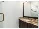 Bathroom with granite countertop, large mirror, and shower at 12550 E Silver Spur St, Scottsdale, AZ 85259