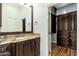 Bathroom with dark wood cabinets and granite countertop at 12550 E Silver Spur St, Scottsdale, AZ 85259
