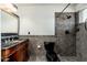 Bathroom with dark wood vanity and tiled shower/tub combo at 12550 E Silver Spur St, Scottsdale, AZ 85259