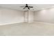 Spacious bedroom with ceiling fan and neutral carpeting at 12550 E Silver Spur St, Scottsdale, AZ 85259