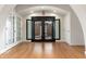 Open entryway with hardwood floors and arched doorways at 12550 E Silver Spur St, Scottsdale, AZ 85259
