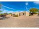 Stucco home with a large garage and a circular driveway at 12550 E Silver Spur St, Scottsdale, AZ 85259