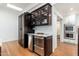 Kitchen wet bar with wine cooler and granite countertop at 12550 E Silver Spur St, Scottsdale, AZ 85259