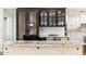 Custom kitchen island with wine storage and granite countertop at 12550 E Silver Spur St, Scottsdale, AZ 85259