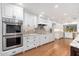 Spacious kitchen with double oven and white cabinetry at 12550 E Silver Spur St, Scottsdale, AZ 85259