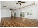 Main bedroom with hardwood floors and multiple ceiling fans at 12550 E Silver Spur St, Scottsdale, AZ 85259
