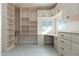 Bright office space with built-in cabinetry and shelving at 12550 E Silver Spur St, Scottsdale, AZ 85259