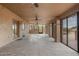 Covered patio with ceiling fans and backyard access at 12550 E Silver Spur St, Scottsdale, AZ 85259