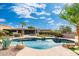 Inviting kidney-shaped pool with spacious backyard and desert landscaping at 12550 E Silver Spur St, Scottsdale, AZ 85259