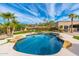 Freeform swimming pool with surrounding landscape at 12550 E Silver Spur St, Scottsdale, AZ 85259