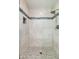 Large shower with tiled walls and a mosaic accent at 12550 E Silver Spur St, Scottsdale, AZ 85259