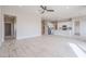 Open concept living room and kitchen with modern appliances at 28205 N 213Th Dr, Wittmann, AZ 85361