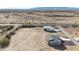 New construction single-story home from above with desert landscaping at 28211 N 213Th Dr, Wittmann, AZ 85361