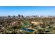 Aerial view of the neighborhood with city skyline in the background at 2921 N Manor Dr, Phoenix, AZ 85014