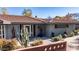 Mid-century modern home with a landscaped front yard and a circular driveway at 2921 N Manor Dr, Phoenix, AZ 85014