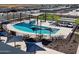 Community pool with shaded seating and lounge chairs at 3213 E Hayden Rose Ave, San Tan Valley, AZ 85143