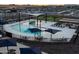 Modern community pool with splash pad, ample seating, and shade structures at 3375 E Audrey Dr, San Tan Valley, AZ 85143