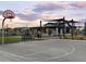 Community basketball court with seating area and clubhouse view at 3375 E Audrey Dr, San Tan Valley, AZ 85143