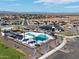 High angle view of the community with pool, park, and surrounding homes at 3387 E Audrey Dr, San Tan Valley, AZ 85143