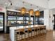 Clubhouse kitchen featuring an island with bar seating, stainless steel appliances, and contemporary design at 3387 E Audrey Dr, San Tan Valley, AZ 85143