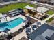 Community pool with shaded seating, lounge chairs, and a splash pad at 3390 E Audrey Dr, San Tan Valley, AZ 85143