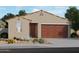 Charming single-story home with a two-car garage and landscaped front yard at 3390 E Audrey Dr, San Tan Valley, AZ 85143