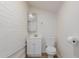 Clean bathroom with white vanity, toilet, and tiled walls at 3622 W Sunland Ave, Phoenix, AZ 85041