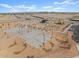 Aerial view of community park with playground, ramadas, and open space at 36957 W Prado St, Maricopa, AZ 85138