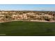 Scenic view of a golf course with luxury homes in the background at 40070 N 111Th Pl, Scottsdale, AZ 85262