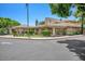 Exterior view of the clubhouse with covered walkways and surrounding landscaping at 5200 S Lakeshore Dr # 204, Tempe, AZ 85283