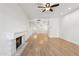 Living room with fireplace and wood floors, open to dining area at 5200 S Lakeshore Dr # 204, Tempe, AZ 85283
